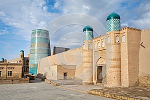 Gate of Kunya-Ark citadel and Kalta Minor minaret in Khiva