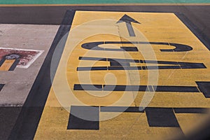 Gate layout on the asphalt in airport terminal. Yellow color. Travel concept