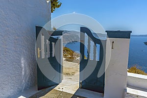 A gate leading towards the path on the edge of Skaros Rock, Santorini