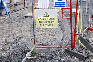 Gate must be locked at all times security sign at construction site