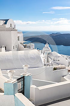 Gate to the sea Santorini island. Traditional white architecture of Santorini with sea view and soft sunset light