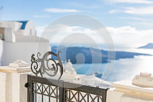 Gate to the sea Santorini island. Traditional white architecture of Santorini with sea view and soft sunset light