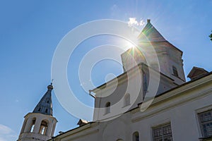 Gate Tower of Shopping Arcade in sunlight against blue sky at Yaroslav`s Court in Velikiy Novgorod, Russia. Architectural landmar