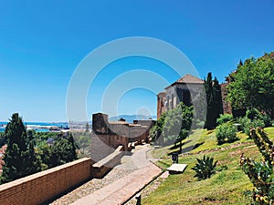 Gate of the Wall and the Gardens of the Alcazaba in the City of Malaga, Andalusia, Spain