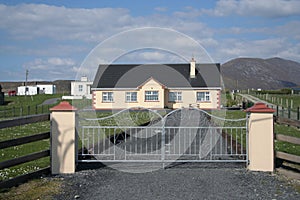 Gated drive and house photo