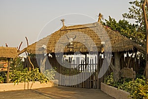 Gated entrance with thatch roof