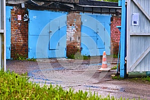 Gated garage complex on the background of stormy sky color