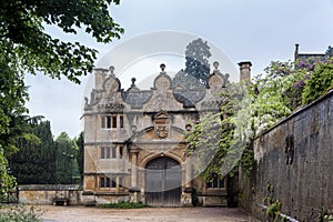 Gatehouse of the Stanway Manor House built in Jacobean period in guiting yellow stone, in the Cotswold village of Stanway