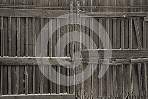 The gates of the old barn sprinkled with frost.