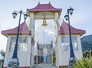 Gates and statue of Buddha in the yard of the buddhist temple