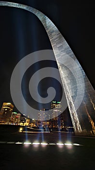 Gateway arch national park st louis MO at night frames the city spot lights