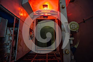 Gateway corridor of airlock of abandoned bunker. Big hermetic door