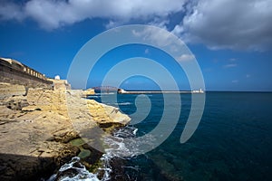 The gateway to the waters of Valletta. Lighthouse. Coast of the island of Malta