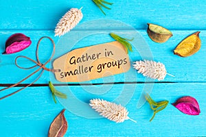 Gather in smaller groups text on paper tag