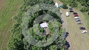 Gathering of a group of farmers in the fields. aerial video