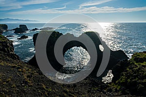 Gatklettur, natural arch rock in the cliff of Arnarstapi, Snaefellsnes peninsula Iceland photo