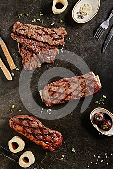 Gaucho Steak, Flank Steak and Tri-Tip Steak on Dark Backdrop photo