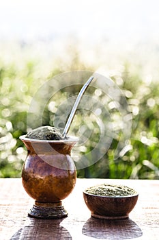 Gaucho yerba mate tea, the chimarÃ£o, typical brazilian drink, traditionally in a cuiade bombilla stick gourd against wooden