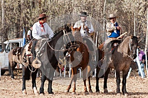 Gauchos riding a horse