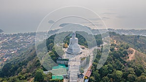 Gautama Buddha statue on the hill in Phuket town. Aerial view.