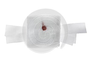 Gauze bandage with blood on white.