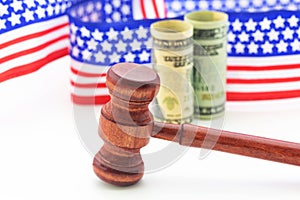 Gavel, American currency, and stars and stripe ribbon