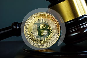 Gavel and Bitcoin coin. Crypto law and regulation of cryptocurrency