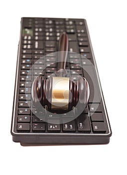 Gavel on black computer keyboard