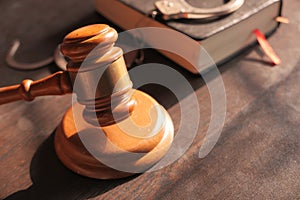 Gavel and book on table close up