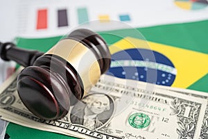 Gavel on Brazil flag with graph and US dollar banknotes  for judge lawyer. Law and justice court concept