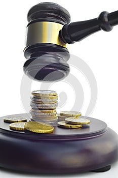 GAVEL WITH COINS ON THE BASE