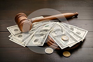 Gavel with dollars and cents