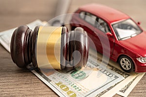 Gavel for judge lawyer with car on US dollar money banknotes, Car loan, Finance, saving money, law, insurance and leasing time