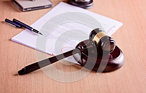 Gavel and judgement on desk.