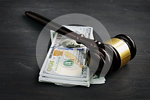 Gavel and money in the court. Penalty or bribe photo