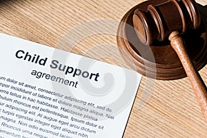 Gavel near document with child support agreement