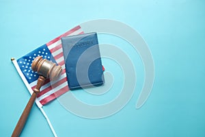 a gavel and passport on a american flag