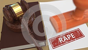 Gavel and RAPE stamp on the paper. Court related 3d rendering