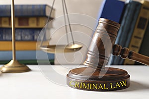 Gavel, scales of justice and books on table. Criminal law concept