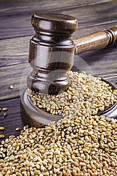 Gavel and scattered wheat grains