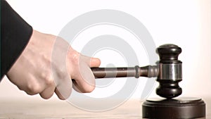 Gavel in slow motion hitting a sound block