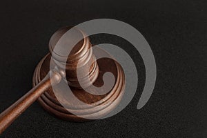 Gavel and sounding block. Black background. Justice and law concept