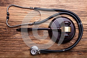 Gavel With Stethoscope Arranged On Table