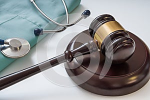 Gavel and stethoscope in background. Medical laws and legal concept