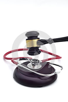 GAVEL WITH A STETHOSCOPE ON THE BASE