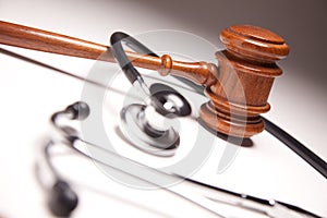 Gavel and Stethoscope on Gradated Background