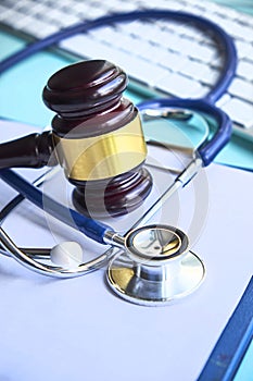 Gavel and stethoscope. medical jurisprudence. legal definition of medical malpractice. attorney. common errors doctors photo