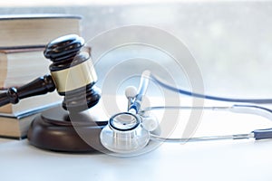 Gavel and stethoscope. medical jurisprudence. legal definition of medical malpractice. attorney. common errors doctors