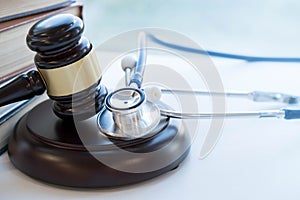 Gavel and stethoscope. medical jurisprudence. legal definition of medical malpractice. attorney. common errors doctors