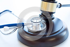 Gavel and stethoscope. medical jurisprudence. legal definition of medical malpractice. attorney. common errors doctors